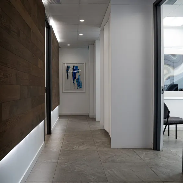 The clinic hallway with walnut panels