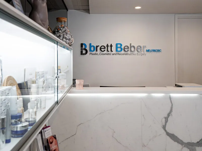 The brett Beber sign above the marble reception desk